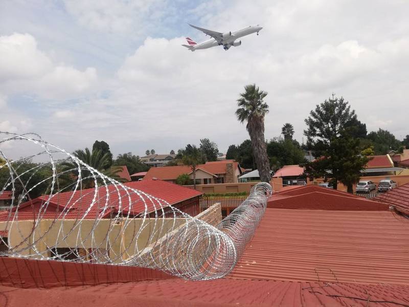Concertina ripper coil 730mm razor wire fitted on a wall and rooftop